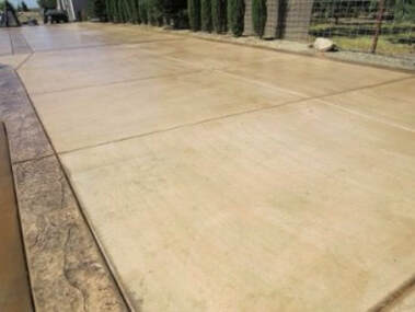 this is a picture of concrete driveway installation in tracy, ca