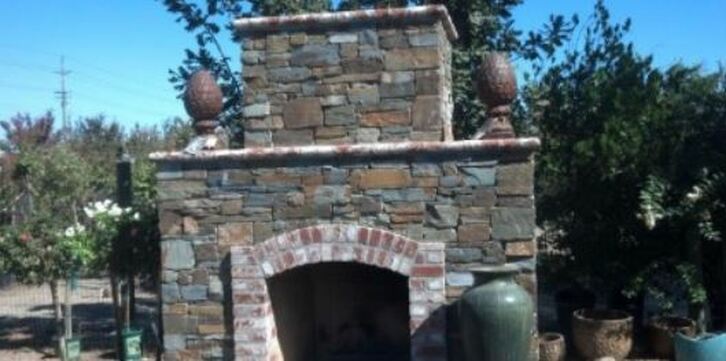 a picture of a stacked stone masonry fireplace in tracy, ca
