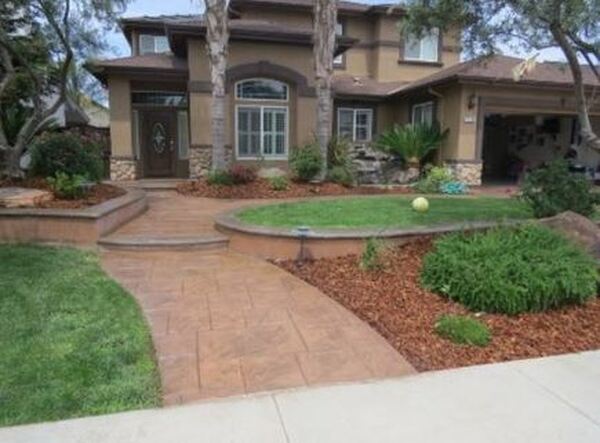 This is an image of stamped concrete driveway Tracy